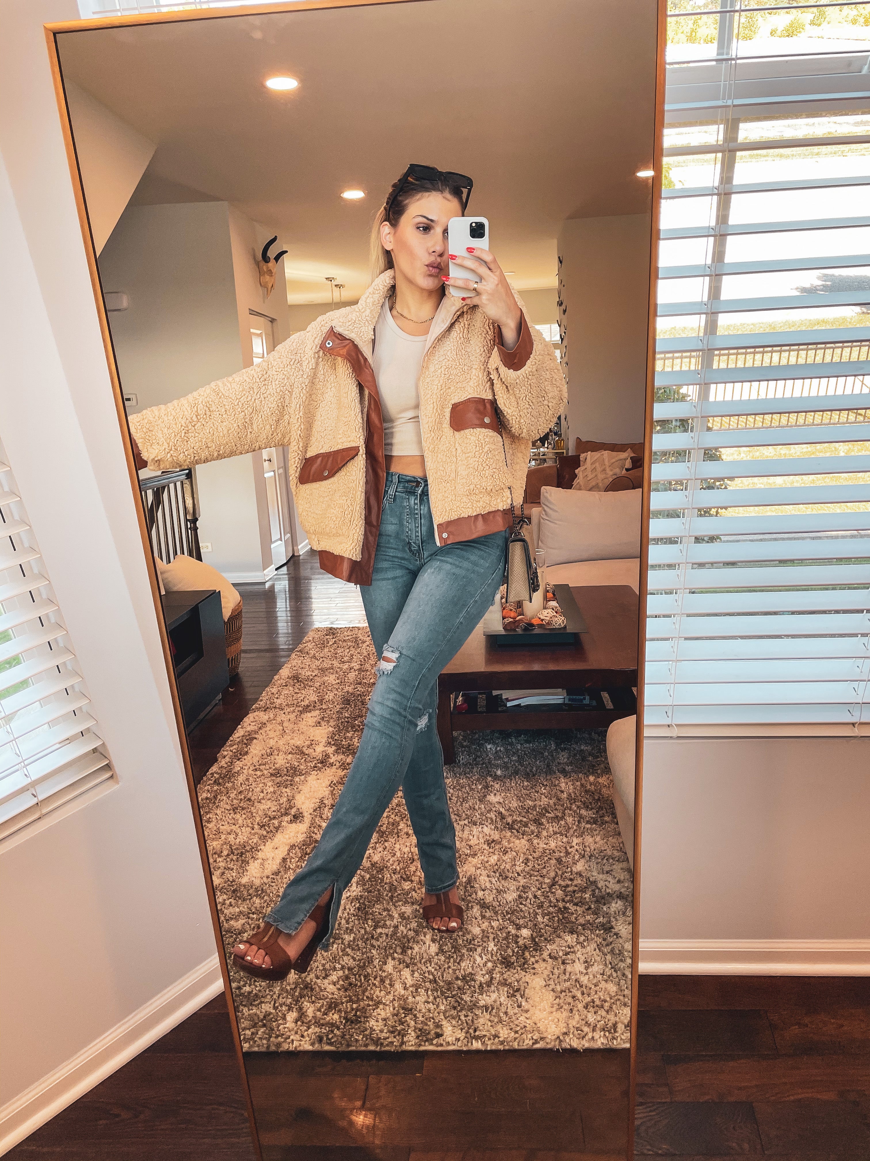 Anawearingaspennightsteddycoatwithcoastlinebootcutjeansandcaboribbedcrop-1